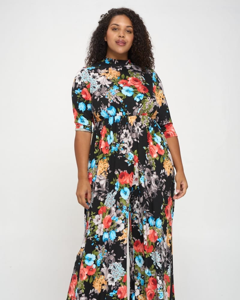Front of a model wearing a size 1X Harmony Floral Jumpsuit in Black/Coral/Grey by L I V D. | dia_product_style_image_id:241440